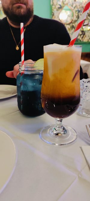 Butterfly pea flower ice tea and boozy Thai milk tea at Mali Vegan Thai in South West London