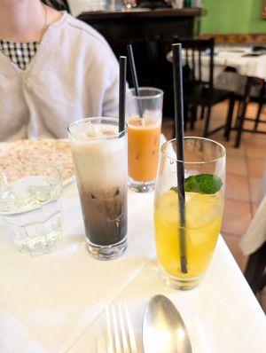 Milk tea at the back (stirred), milk coffee next, mango tea closest to the front at Mali Vegan Thai in South West London