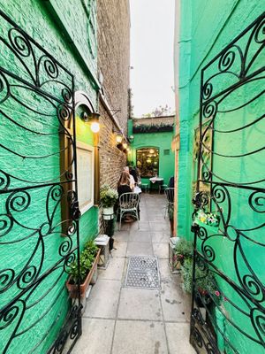 Entrance from street and outdoor garden seating   at Mali Vegan Thai in South West London