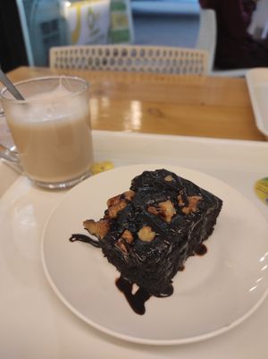 Warm vegan brownie and coconut milk tea at Always Happy Food co. in Kathmandu