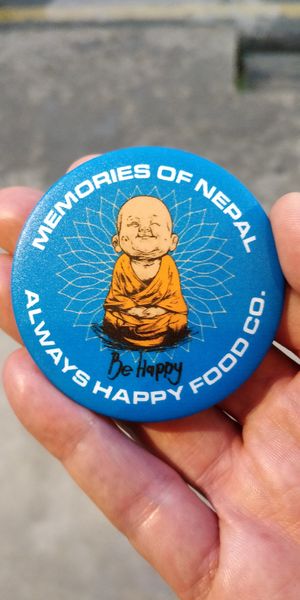 A badge the owner gave me 😊 at Always Happy Food co. in Kathmandu