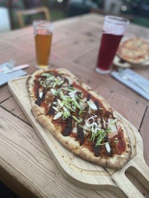 Vegan flatbread with hoisin sauce, “duck” and spring onions at The Magic Garden in Nottingham