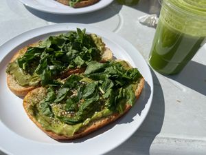 Avocado toast and green juice   at Atomic Cafe in Beverly