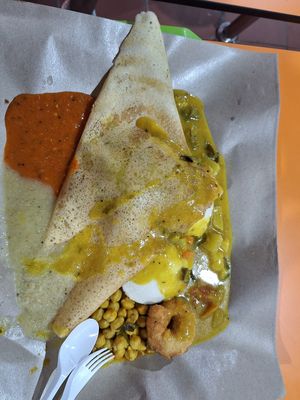 Dosa with idly underneath and a free vadaa at S.P. Villas in Central Singapore