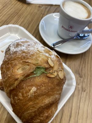 Pistacchio cream filled croissant and oat milk macchiato  at FCO - Natoo in Fiumicino