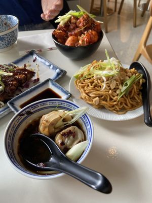 Dandan noodles in the middle are creamy and peanutbuttery. The Korean fried cauliflower, tempeh katsu and wonton are also tasty. at Veganees in Amsterdam