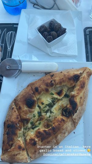 Garlic bread and unpitted olives   at Cucina Italiana in Kos