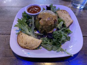 Stuffed pepper with cheeze sauce  at Pauseitively Vegan in Deerfield Beach