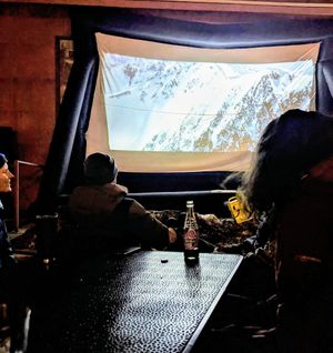 Movie night in the courtyard area where the food truck is located at 1874 Food Truck in Del Norte