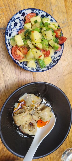 Avocado salad and wantans with chili oil at The Butterfly Lovers in Berlin