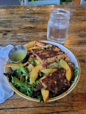 Spectacular! SOUTHERN BELLE SALAD (with tempe minus chees and honey) e**

Choice of grilled protein over spring greens with fresh peaches, roasted sweet potatoes, candied pecans an at The Floridian in St Augustine