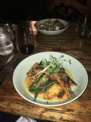 tempeh with a tomato red pepper type sauce and green beans and fingerling potatoes  at The Floridian in St Augustine