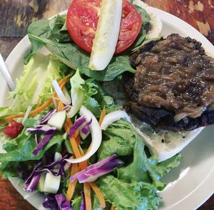Black bean and sweet potato “Dixie Burger” with sautéed onions.  at The Floridian in St Augustine