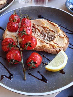 Hummus and roasted balsamic tomato on toast at Laughing Dog in Brighton