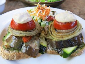 Grilled Vegetable sandwiches with cashew cheese although they are served more like a stack of vegetables on bread. at Soma Cafe in Ubud