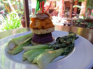 Tower of Power (stack of grilled jicama, mashed purple sweet potatoes, grilled pineapple, ginger mashed pumpkin topped with grilled onion and served with local greens) at Soma Cafe in Ubud