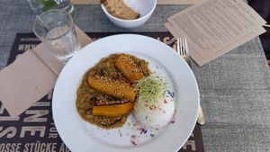 Delicious grilled butternut squash with tograshi and sesame; flageolet beans with shitake, ginger and tamari - served with jasmine rice. at Mairübe in Luzern