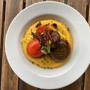 Swiss polenta with roasted tomatoes, mushrooms, a cashew pesto and root vegetable crunch. at Mairübe in Luzern