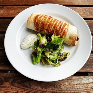 Our signature burrito filled with chili sin carne, served with a side salad and home-made tartar sauce. at Mairübe in Luzern