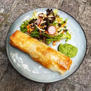 Filo-pastry stuffed with spring vegetables and lentils, served with a side salad and home-made guaca-no!-le. at Mairübe in Luzern