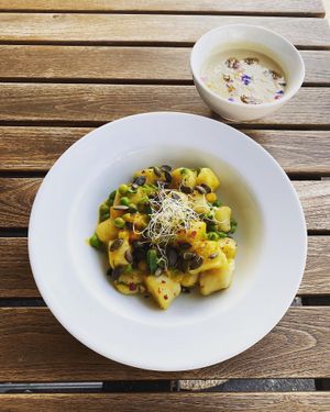 Home-made ghnocchi on a saffran sauce with peas and pumpkin seeds at Mairübe in Luzern