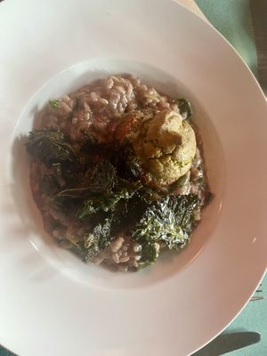 Red wine risotto with leeks, big mushroom filled with cashew herb butter and kale chips  at Mairübe in Luzern