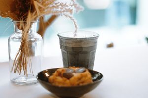 Special drinks like charcoal latte, golden milk, matcha latte are on the menu. You will find lot of plant-based milks option.  at Peacock in Toulouse