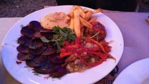 Hummus, beet carpaccio, escalivada, salad, fries and stuffed mushrooms at Faristol in Altafulla