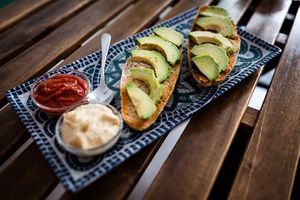 Toast with hummus, peppers, and avocado at REVIV in Malaga