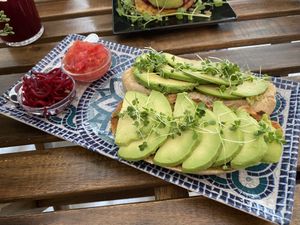 Toast with avocado and tomato   at REVIV in Malaga