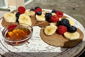 Vegan pancakes with fruit and good maple syrup   at REVIV in Malaga