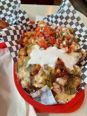 Giant totchos, very fresh pico de gallo, green chilis, "cheese", chilj at Vegan Junk Food in Portland