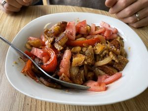 The Jared bowl which has potatoes, onions, peppers, and tomatoes, plus vegan cheese.  at Fired On The Mountain Cafe in Lincoln