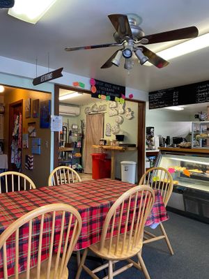 Seating area, bathroom sign at Fired On The Mountain Cafe in Lincoln