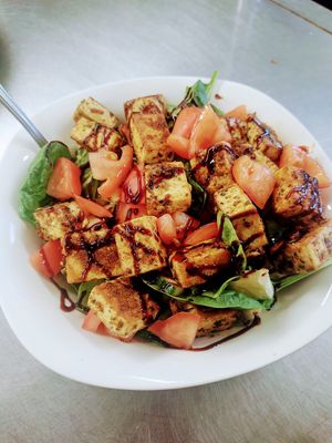 Vegan tofu bowl topped with balsamic reduction at Fired On The Mountain Cafe in Lincoln