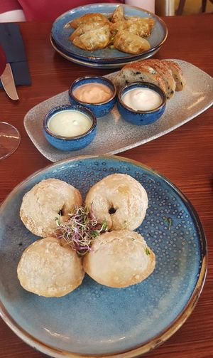 Bottom to top: empanadas, olive bread with 3 sauces, dumplings (all vegan) at From Heaven in Bad Ragaz