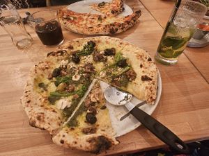 Vegan stilton, fig, broccoli and walnut pizza and apple mocktail at Slow Rise Pizza in Lincoln