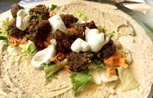 My wrap being made, yummy home made hummus and falafel #Veganuary at Roots - Braunton in Braunton