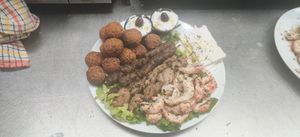 Vegan Mixed Grill Sample Platter for 2. 
10 Spicy Falafels, 2 Vegan Lamb Skewers, 2 Vegan Chicken Skewers, 2 Vegan Shrimp Skewers, 2 x 2oz Vegan Tzatziki, 2 pieces of Vegan Feta. at Eviva Taverne Grecque in Dollard-des-ormeaux