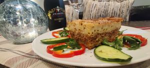 Vegan Pastitsio. Made with a bottom layer of Pasta, followed by a layer of Seasoned Vegan Homemade Ground Soy Meat then a top layer of Pasta and topped with a Vegan Bechamel Sauce. at Eviva Taverne Grecque in Dollard-des-ormeaux