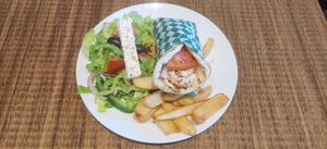 Vegan Shrimp Pita Sandwich. Includes 1 Vegan Shrimp Pita Sandwich, Village Salad with a piece of Vegan Feta and a choice of Fries, Rice or Roasted Greek Potatoes. at Eviva Taverne Grecque in Dollard-des-ormeaux