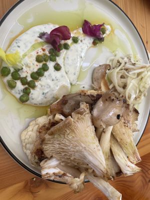 Cauliflower steak with chanterelles mushrooms, fennel Cole slaw, and even edible snapdragon flowers.  at Grajska Plaža in Bled