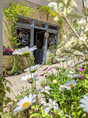 Flowers on the terrace at Rivers Coffee Shop in Limeuil