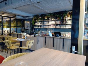 Some of the tables and the till at De Wit Wasserij in Nijmegen