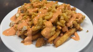 Vegan
Mc Clucker fries
Fries topped with vegan [inhouse made] mac & cheese & vegan tenders at Boon Cafe in Norridge