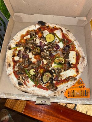 Vegan pizza with plant based cheese  at Finisterre in Bacalar