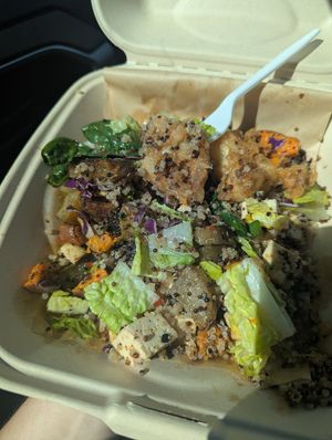 Buddha bowl mixed up and a bite already taken, I couldn't wait lol. at Gather Cafe Bistro Bar in Talent