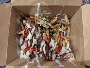 Mixed grill loaded fries (half eaten) at Dhil's in Wigston