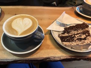 Oat milk latte with smores syrup and vegan chocolate cake   at Olive in Thurso