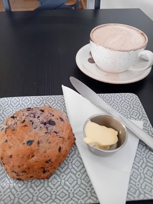 Blueberry vg scone with d/f spread and vg salted caramel hot chocolate at Reggie's Cafe in Whitley Bay